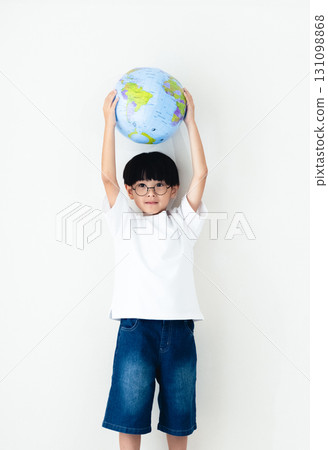 Boy holding a globe ball 131098868