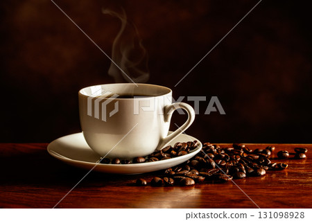 Hot coffee and coffee beans on the table 131098928