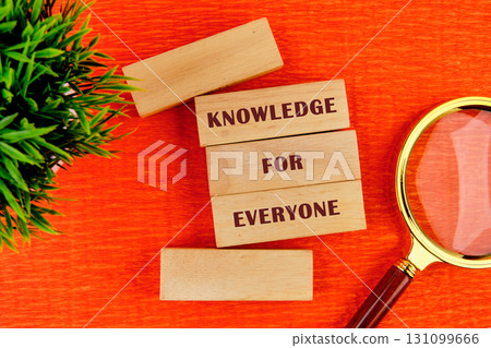 Education Concept text KNOWLEDGE FOR EVERYONE assembled from wooden blocks in composition with magnifying glass and green plant on orange background, top view Education Concept text KNOWLEDGE FOR EVERYONE assembled from wooden blocks in composition with magnifying glass and green plant on orange background, top view 131099666