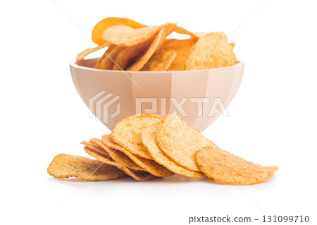 Crispy potato chips isolated on white background. 131099710