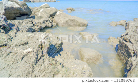 Close-up of Rugged Coastal Boulders and Clear Water Close-up of Rugged Coastal Boulders and Clear Water 131099768