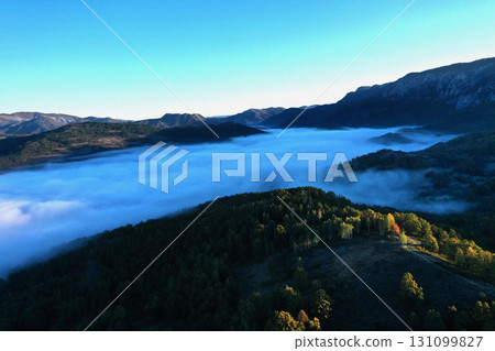 Aerial view of autumn morning mist and clouds in the valley 131099827