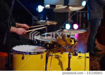 Drummer playing live on stage at blues concert 131100801