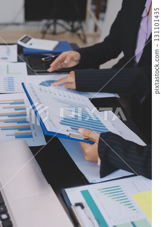 Team of business people working together in the meeting room office,teamwork background charts and graphs banner, double exposure successful teamwork,business planning concept. 131101435