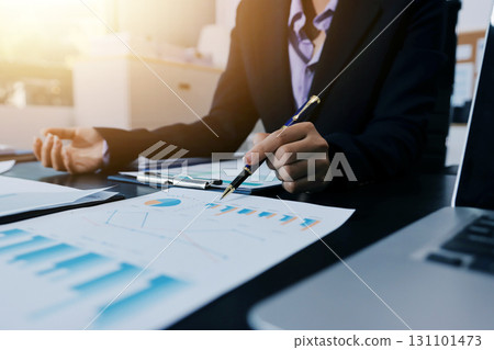 Team of business people working together in the meeting room office,teamwork background charts and graphs banner, double exposure successful teamwork,business planning concept. 131101473