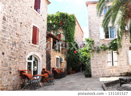 Famous landmark - old town Budva, historical center. Picturesque pedestrian street with old medieval buildings, Budva, Montenegro. Topic of summer vacation, travel, cruises and tours Famous landmark - old town Budva, historical center. Picturesque pedestrian street with old medieval buildings, Budva, Montenegro. Topic of summer vacation, travel, cruises and tours 131101527