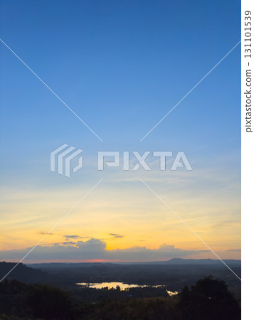 Vertical wide view of lake and forest with sunset sky Vertical wide view of lake and forest with sunset sky 131101539