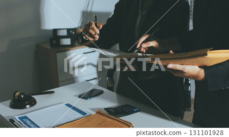 Lawyer explained to the client about the law that must be brought against the court case. 131101928