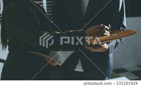 Lawyer explained to the client about the law that must be brought against the court case. Lawyer explained to the client about the law that must be brought against the court case. 131101929