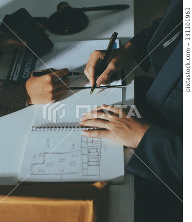 Lawyer explained to the client about the law that must be brought against the court case. 131101961