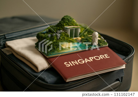 AI generated photo of Singapore passport with a 3D diorama showcasing iconic landmarks. The passport is placed on a suitcase with clothes. Great for travel or Singapore-related content. 131102147