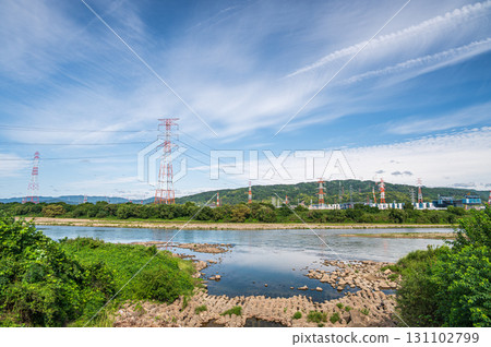 Power line tower standing on the banks of the Yodo River, Takatsuki City, Osaka Prefecture Power line tower standing on the banks of the Yodo River, Takatsuki City, Osaka Prefecture 131102799