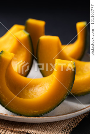 Steamed Japanese pumpkin or Kabocha on plate ready to eating, Healthy food 131103777