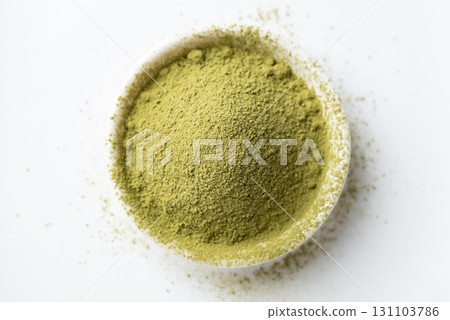 Top view of matcha green tea powder in bowl on white background Top view of matcha green tea powder in bowl on white background 131103786