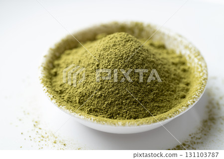 Matcha green tea powder in bowl on white background 131103787