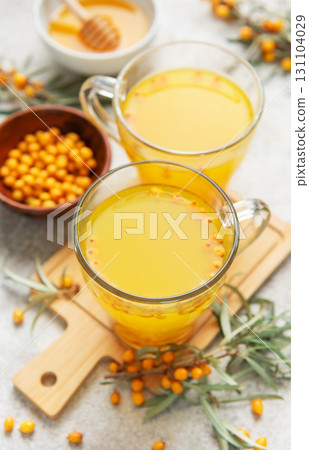 Sea buckthorn hot drink with honey promoting wellness Sea buckthorn hot drink with honey promoting wellness 131104029