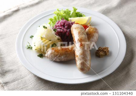 Grilled sausages and garnish Grilled sausages and garnish 131104340