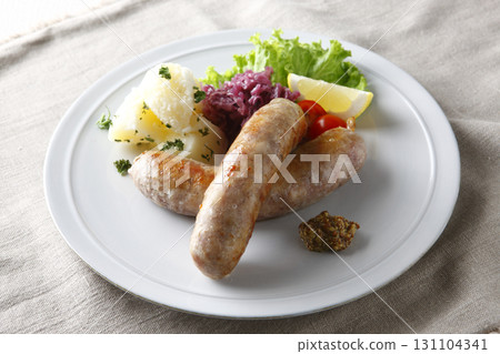 Grilled sausages and garnish Grilled sausages and garnish 131104341