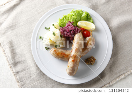 Grilled sausages and garnish Grilled sausages and garnish 131104342