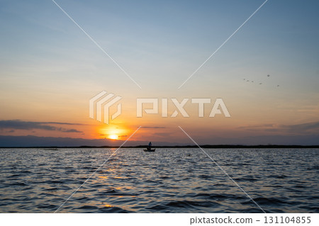 Boat at sunset on Lake Tempe, Sulawesi, Indonesia 131104855