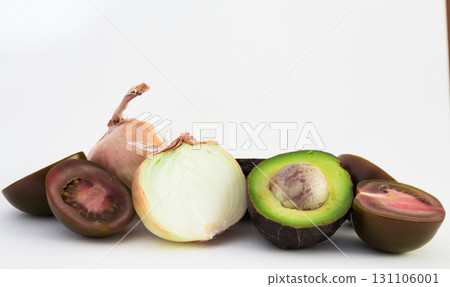 vegetables black tomatoes, avocado and onions on white background vegetables black tomatoes, avocado and onions on white background 131106001