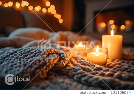Warm cozy candlelight scene soft knitted blanket home interior Warm cozy candlelight scene soft knitted blanket home interior 131106054