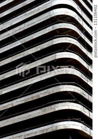 Building under construction. Concrete structure with multiple floors, balconies, raw framework, Building under construction. Concrete structure with multiple floors, balconies, raw framework, 131106402