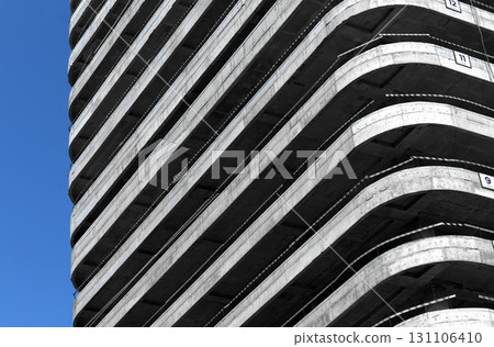 Construction in progress. Brutalist highrise building with concrete skeleton, repetitive balconies, Construction in progress. Brutalist highrise building with concrete skeleton, repetitive balconies, 131106410