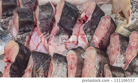 Frozen sea and freshwater fish on a supermarket shelf Sliced and whole Seafood Frozen sea and freshwater fish on a supermarket shelf Sliced and whole Seafood 131106557