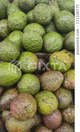 Avocados in large crates on store shelves. Fruit display and sale. Avocados in large crates on store shelves. Fruit display and sale. 131106575