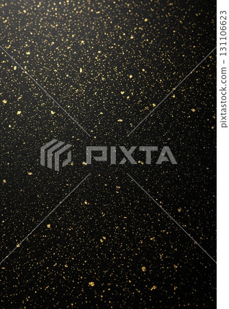 Golden Splatter on Dark Background Textured Surface with Scattered Golden Glitter and Black 131106623