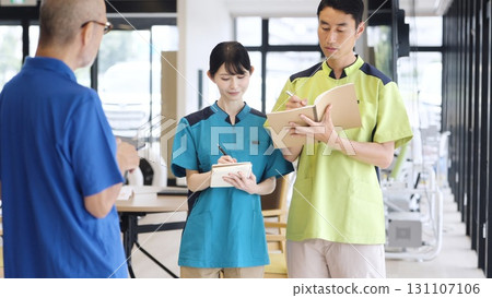 Asian caregivers undergoing training 131107106