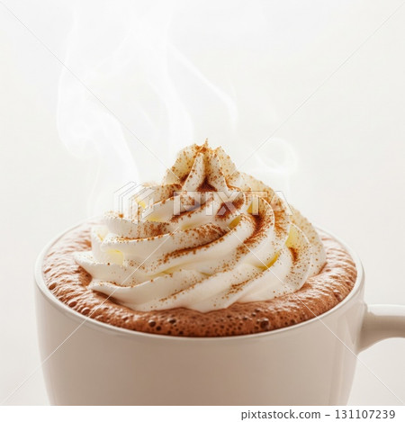 Hot Chocolate Beverage with Whipped Cream Topping and Cinnamon Against White 131107239