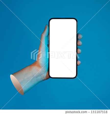Lodz Poland May 01 2025 Hand holding smart phone, mobile device screen over blue background. Lodz Poland May 01 2025 Hand holding smart phone, mobile device screen over blue background. 131107318