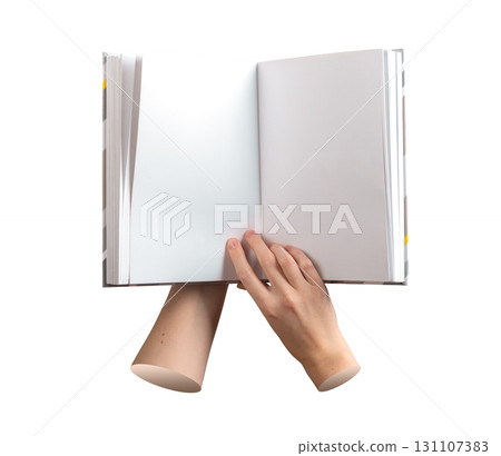 Reading moment with open book in hand. The pages are empty and clean, with no writing, showing a 131107383