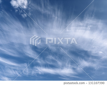 Sky with cirrus clouds. Wispy feather-like formations in bright blue atmosphere, soft texture, clean 131107390