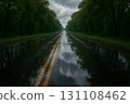 Empty wet highway through dense green forest after rain, double yellow lines 131108462