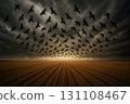 Silhouetted flock sweeping across a stormy sky above golden wheat rows at dusk 131108467