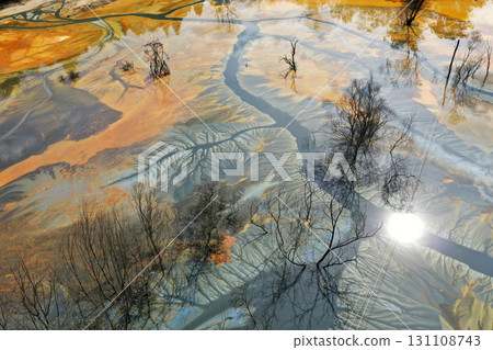 Aerial view of colorful contaminated cyanide residuals waters from gold mine. Abstract nature pattern 131108743