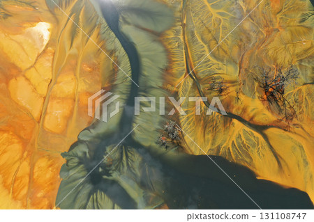 Aerial view of colorful contaminated cyanide residuals waters from gold mine. Abstract nature pattern 131108747