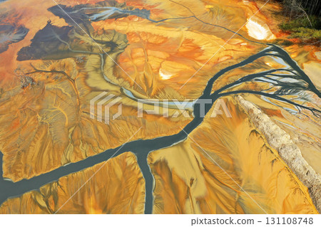 Aerial view of colorful contaminated cyanide residuals waters from gold mine. Abstract nature pattern 131108748
