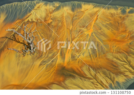 Aerial view of colorful contaminated cyanide residuals waters from gold mine. Abstract nature pattern 131108750