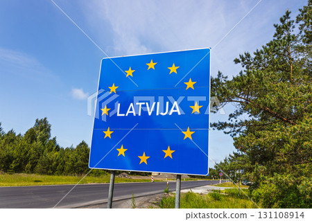 Latvia Border Sign on EU Schengen Entry Road, Blue European Stars, Baltic Route Latvia Border Sign on EU Schengen Entry Road, Blue European Stars, Baltic Route 131108914