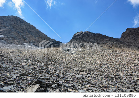 Idyllic summer landscape with hiking trail in the mountains with beautiful stones, National park. Nice view. Kyrgyzstan Idyllic summer landscape with hiking trail in the mountains with beautiful stones, National park. Nice view. Kyrgyzstan 131109890