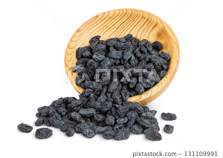 black raisins in wooden bowl isolated on white background black raisins in wooden bowl isolated on white background 131109991