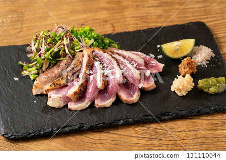 Roasted duck served on a slate plate Roasted duck served on a slate plate 131110044