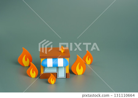 Burning store model around fire. Business loss, financial collapse, crisis, and the vulnerability of small enterprises to economic downturns, disaster, or mismanagement. Fire safety and insurance Burning store model around fire. Business loss, financial collapse, crisis, and the vulnerability of small enterprises to economic downturns, disaster, or mismanagement. Fire safety and insurance 131110664