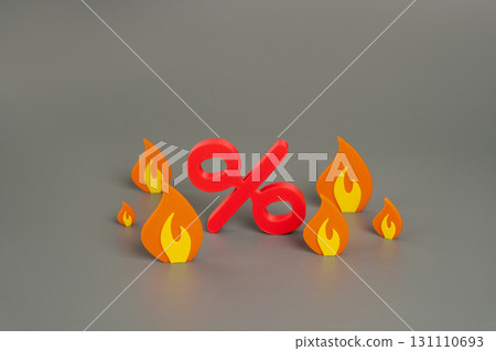 Percent sign and fire. Rising interest rates, financial crisis, inflation pressure, loan stress, or economic instability caused by volatile market conditions. Percent sign and fire. Rising interest rates, financial crisis, inflation pressure, loan stress, or economic instability caused by volatile market conditions. 131110693