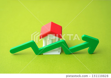 Bank building and green up arrow. Growth of savings in the bank account. Rising bank capitalization, deposit growth, increasing consumer savings. Business and finance 131110828