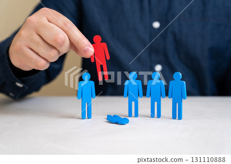 Company director chooses the red figurine of people from the team of employees instead of the blue one. The concept of dismissing a worker and reducing staff. HR processes, recruitment success 131110888